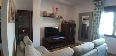 Una televisión o centro de entretenimiento en APARTAMENTO REFORMADO Y LUMINOSO EN AGUILAR DE LA FRONTERA