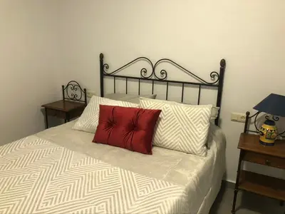 Cama o camas de una habitación en casa Encarni, balcon de las cuevas