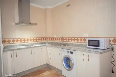 Una cocina o zona de cocina en Modern Apartment in Peñaflor with Air Conditioning - 85 m²