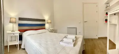 Cama o camas de una habitación en Acogedor apt 8pax 4Bdr 2Bth - CozyHomeSevilla6