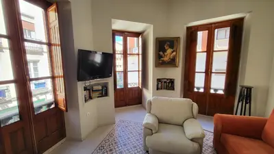 Una televisión o centro de entretenimiento en Exclusivo Apartamento en Linares