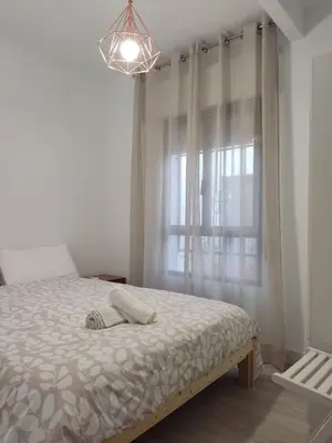 Cama o camas de una habitación en Guimar Momentos, vívelos en Córdoba