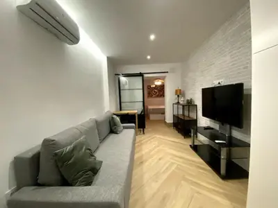 Una televisión o centro de entretenimiento en Apartamento Tibidabo Int con Parking
