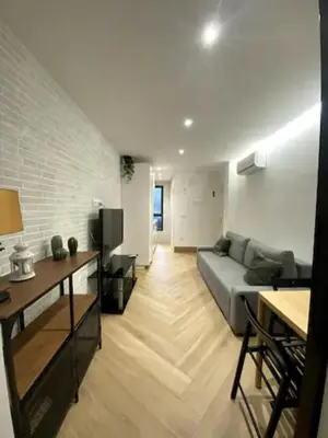 Una televisión o centro de entretenimiento en Apartamento Tibidabo Int con Parking