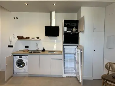 Una cocina o zona de cocina en APARTAMENTOS TURISTICOS SINAG