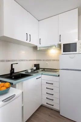 Una cocina o zona de cocina en Misterhost Santiago Céntrico y Acogedor con piscina - Casco Histórico