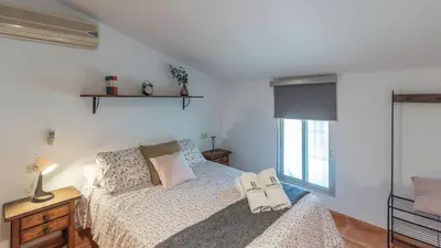Cama o camas de una habitación en Casa Los Baenas Casabermeja by Ruralidays