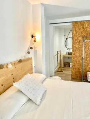 Cama o camas de una habitación en Loft Alameda en Sevilla