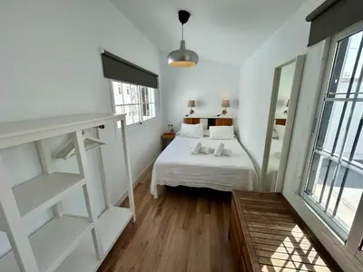 Cama o camas de una habitación en Ático con vistas espectaculares a la Catedral - CozyHomeSevilla7