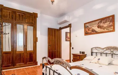 Cama o camas de una habitación en 7 Bedroom Awesome Home In Lucena