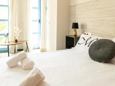 Cama o camas de una habitación en Tejares Suite Cordoba