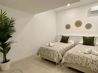 Cama o camas de una habitación en Apartamentos El Olivo
