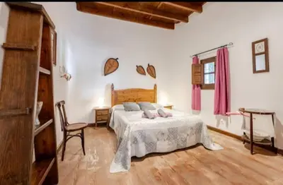 Cama o camas de una habitación en Alojamiento El Cortijuelo