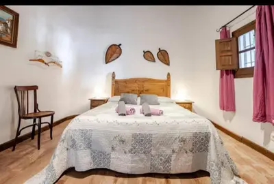 Cama o camas de una habitación en Alojamiento El Cortijuelo