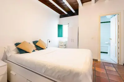 Cama o camas de una habitación en Alohamundi Alcázares