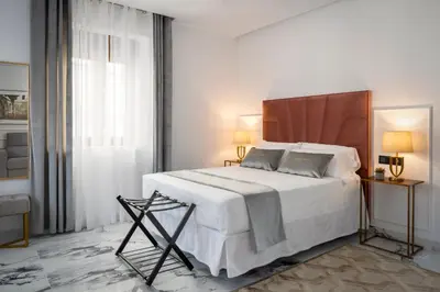 Cama o camas de una habitación en Apartamentos Casa del Arco de 2 a 6 personas