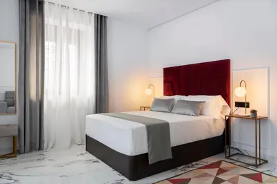 Cama o camas de una habitación en Apartamentos Casa del Arco de 2 a 6 personas