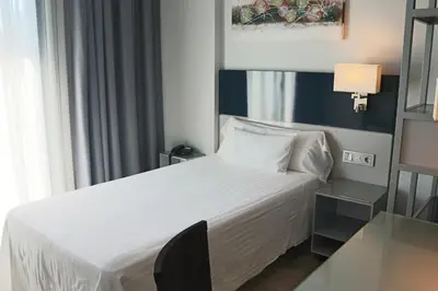 Cama o camas de una habitación en Hotel Santa Eulalia