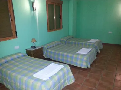 Cama o camas de una habitación en Hostal las Tres Jotas