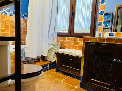 Un baño de Villa ALJARAL, Espectacular,piscina,chimenea, climatización, wifi