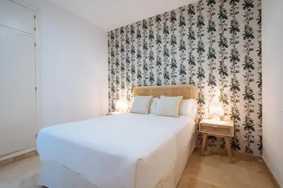 Cama o camas de una habitación en Lirio Suite Apartment - Private Parking included
