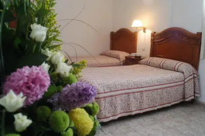 Cama o camas de una habitación en Hotel Riviera