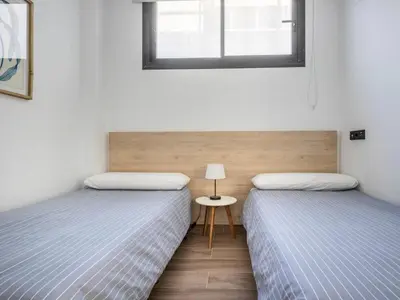 Cama o camas de una habitación en Nervión Suites 2 - Vacacional Sevilla