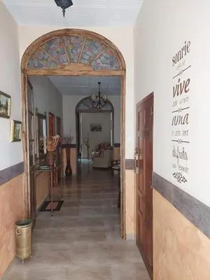 El vestíbulo o zona de recepción de La Plazuela, casa andaluza con patio.