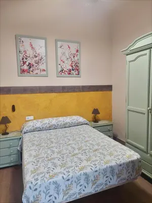 Cama o camas de una habitación en La Plazuela, casa andaluza con patio.