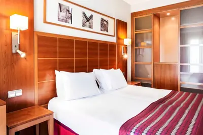 Cama o camas de una habitación en Exe Las Adelfas
