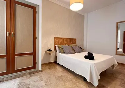 Cama o camas de una habitación en Boho Suite Apartment