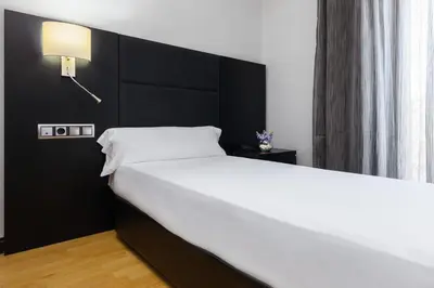Cama o camas de una habitación en Virgen de los Reyes