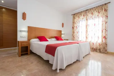 Cama o camas de una habitación en Hotel Riad Arruzafa