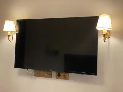 Una televisión o centro de entretenimiento en SUITES SAN ESTEBAN 16 Real