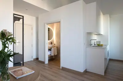 Cama o camas de una habitación en Coliseum Boutique Apartments
