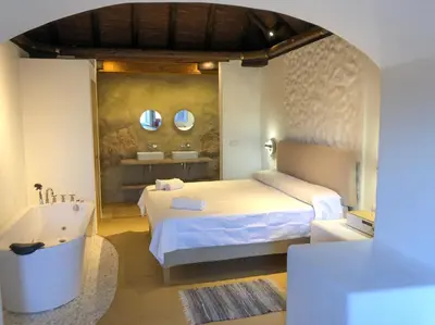 Cama o camas de una habitación en Casa Cueva El Naranjo Rocabella
