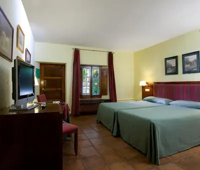 Cama o camas de una habitación en Hotel la Perdiz