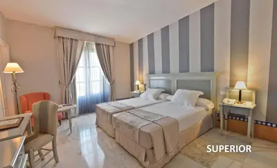 Cama o camas de una habitación en Hotel Alcázar de la Reina