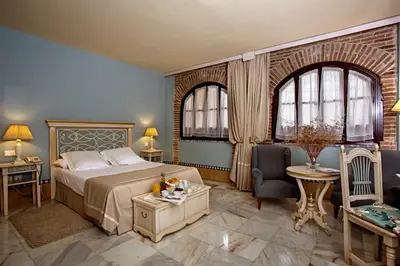 Cama o camas de una habitación en Hotel Alcázar de la Reina