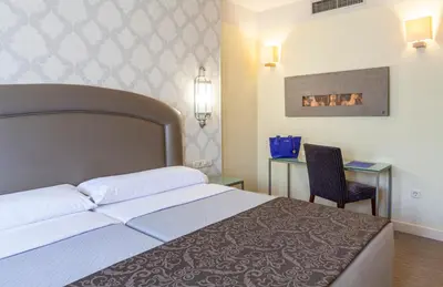 Cama o camas de una habitación en Hotel Macià Alfaros