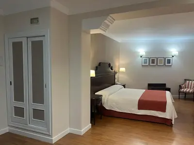 Cama o camas de una habitación en Hotel Santo Domingo Lucena