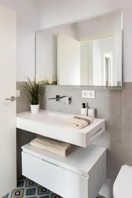 Un baño de One&lux Puerta Osario