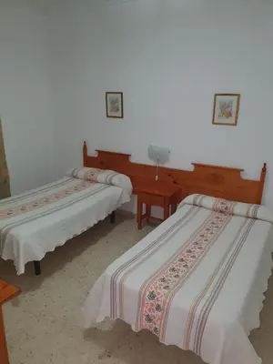 Cama o camas de una habitación en Pensión los Ángeles