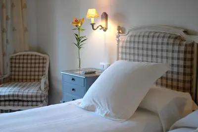 Cama o camas de una habitación en Hotel Puerta de la Luna