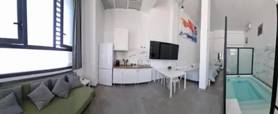 Una televisión o centro de entretenimiento en Loft familiar 