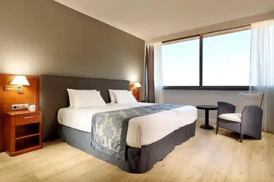 Cama o camas de una habitación en Exe Isla Cartuja