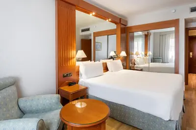 Cama o camas de una habitación en Exe Sevilla Macarena