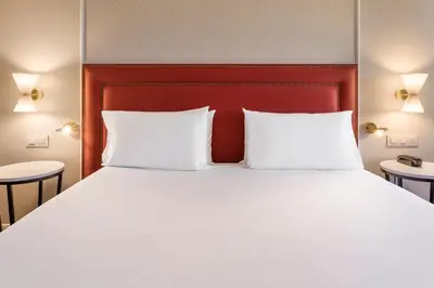 Cama o camas de una habitación en Exe Sevilla Macarena