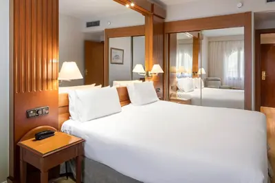 Cama o camas de una habitación en Exe Sevilla Macarena