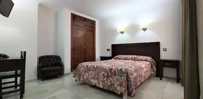 Cama o camas de una habitación en Hotel Averroes